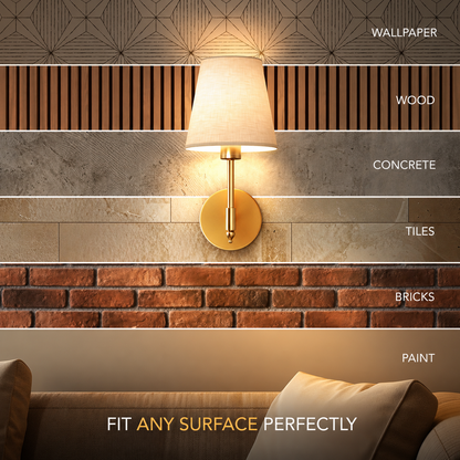 A wall-mounted lamp with a warm white conical shade and gold circular base is shown lit against several horizontal wall finish options labeled Wallpaper, Wood, Concrete, Tiles, Bricks, and Paint. Text at the bottom reads 'FIT ANY SURFACE PERFECTLY.