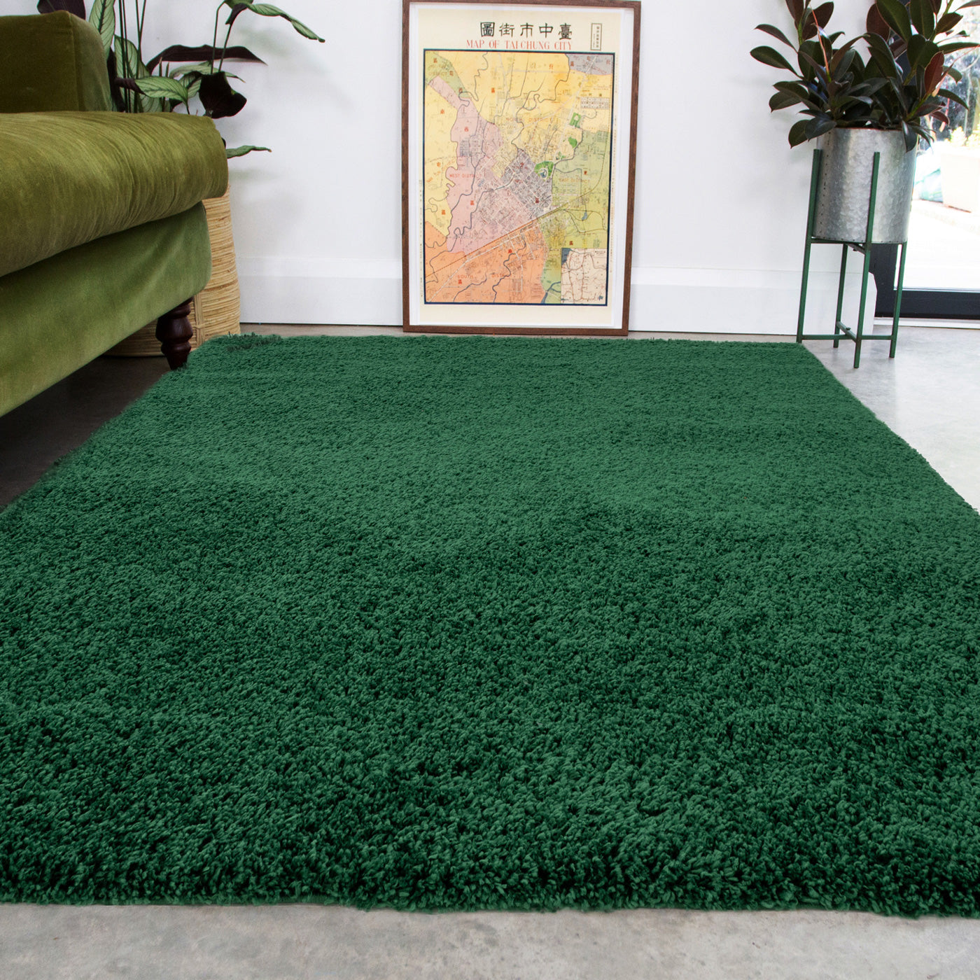 Green shaggy rug in a living room with a green sofa and decorative elements.