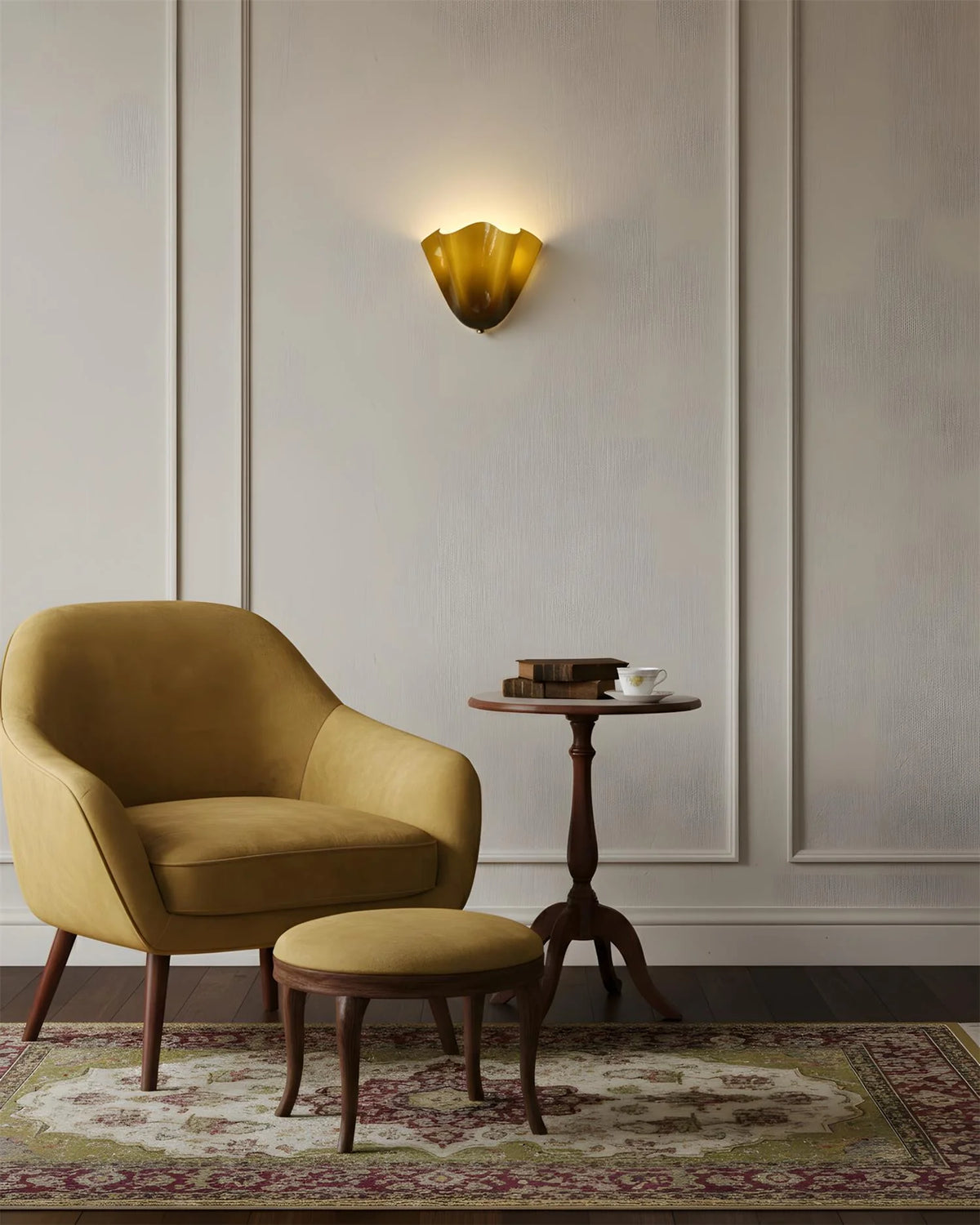 Yellow armchair and ottoman in a room with a wall sconce and side table.