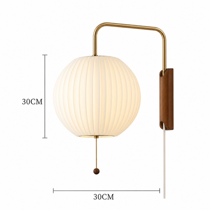 A spherical pleated white wall lamp with a curved brass arm and wooden wall mount, shown with dimension lines indicating 30CM height and 30CM width.