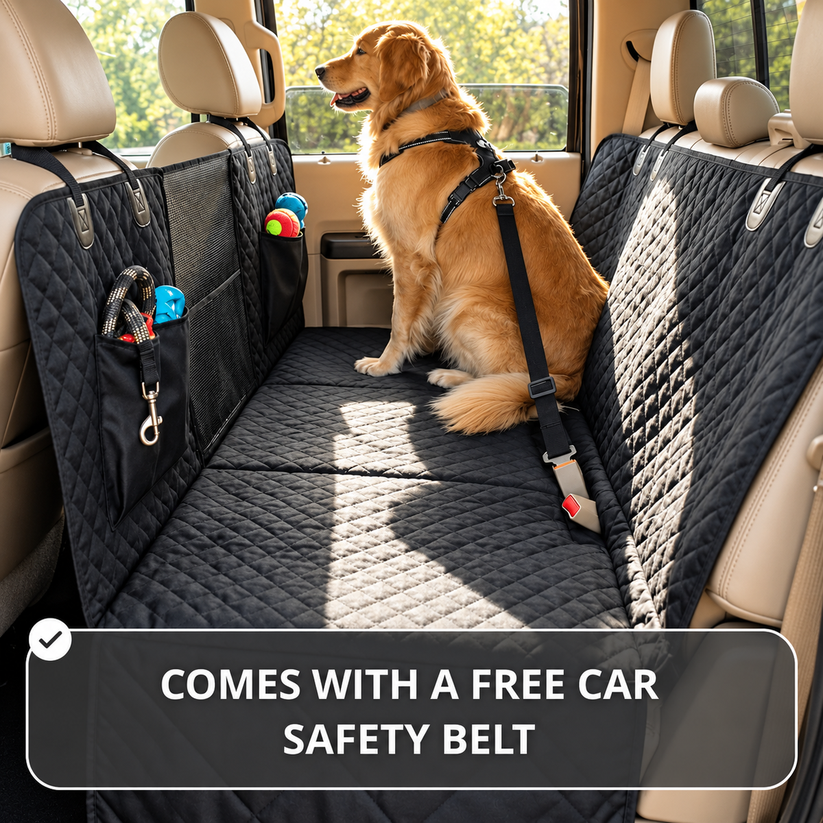 A golden retriever sits on a black quilted pet car seat cover installed across the back of a vehicle. The cover includes side pockets holding small pet toys and a black safety belt attached to the harness.